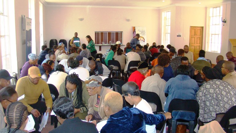 Facilitator Ms. Zainab Aziz of Project Management workshop assisting groups with their activities